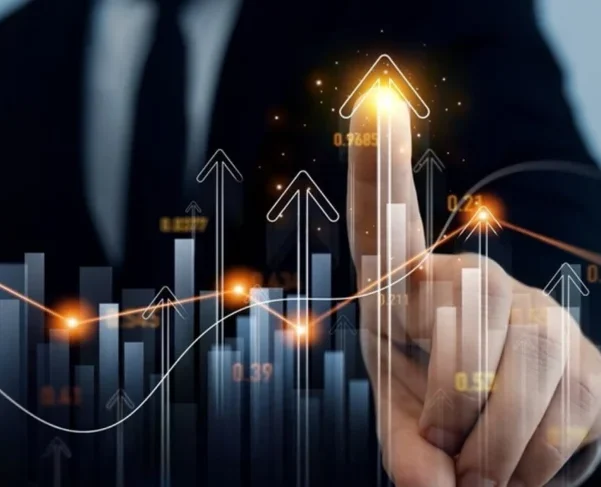 Business professional in a suit pointing to a glowing upward arrow on a virtual chart, representing data growth and rising metrics. Bar graphs, arrows, and glowing data points highlight SaaS growth trends. Global Datasys Group logo is visible in the top-left corner.