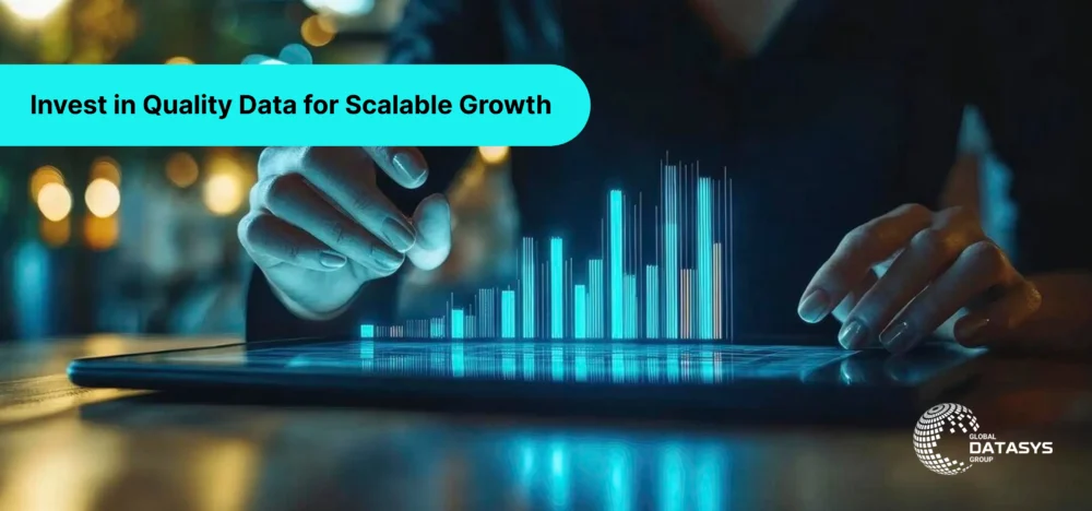 Close-up of a person interacting with a digital tablet displaying glowing 3D bar graphs, representing the power of quality data for business growth. The overlay text reads "Invest in Quality Data for Scalable Growth," and the Global Datasys Group logo is visible in the bottom-right corner.