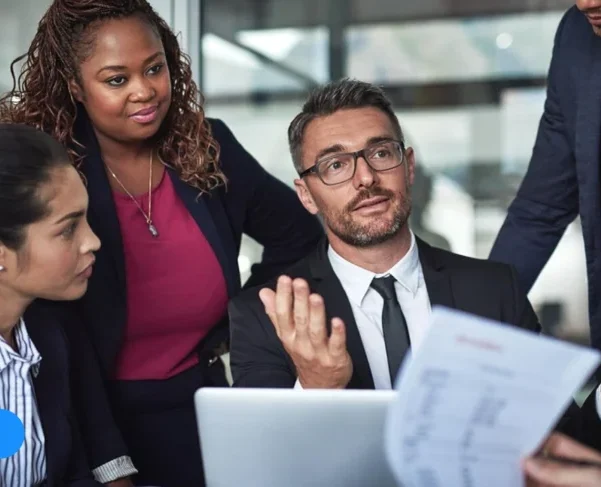 Business professionals discussing strategy at Global Datasys Group – Your Growth Partner in data-driven solutions.